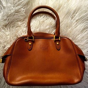 Tan genuine leather Ralph Lauren 1997 tan handbag with black interior.